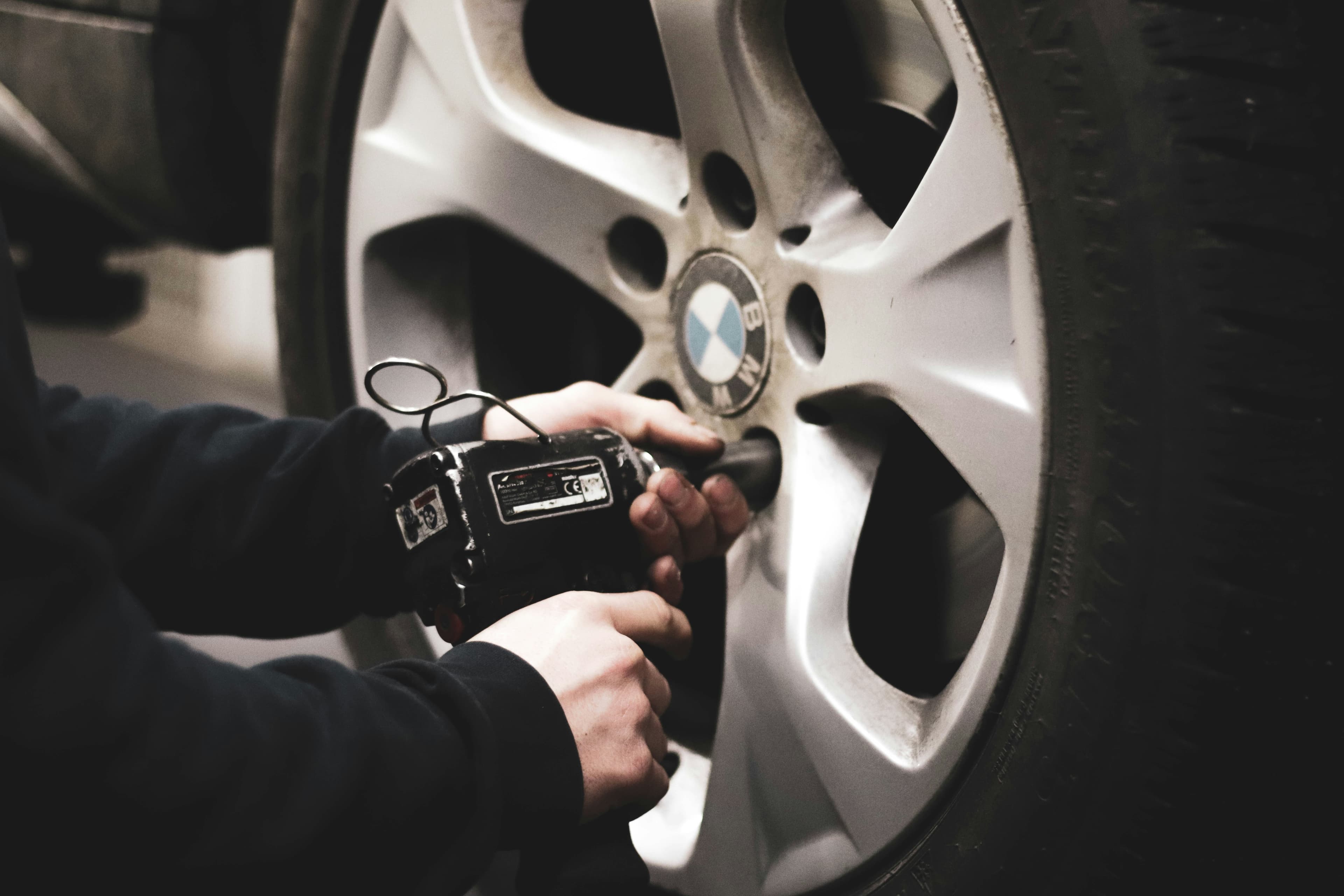 A mobile fitter replacing a tyre